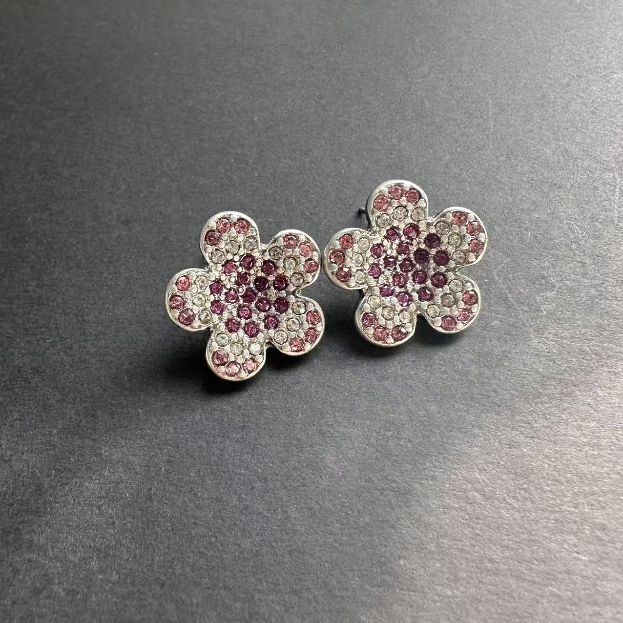 Silver-tone floral stud earrings with pink and red rhinestones