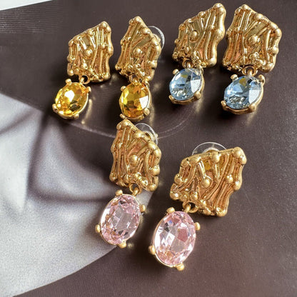 Gold-tone crystal drop earrings with yellow, blue, and pink oval stones