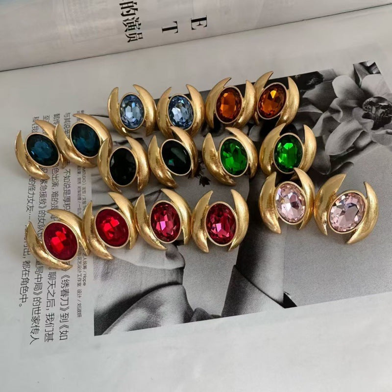 Gold-tone oval crystal earrings with mixed colored faceted stones