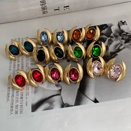 Gold-tone oval crystal earrings with mixed colored faceted stones