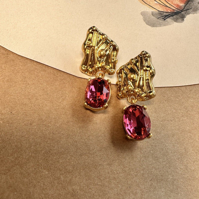 Gold-tone crystal drop earrings with oval red marquise stones