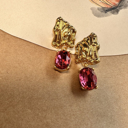 Gold-tone crystal drop earrings with oval red marquise stones