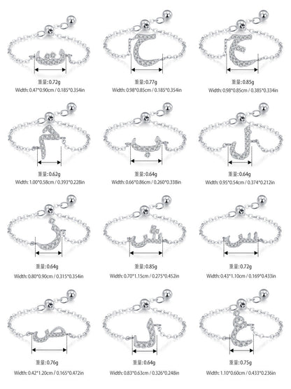 Silver-tone adjustable chain rings with pavé Arabic letter charms, shown with size arrows