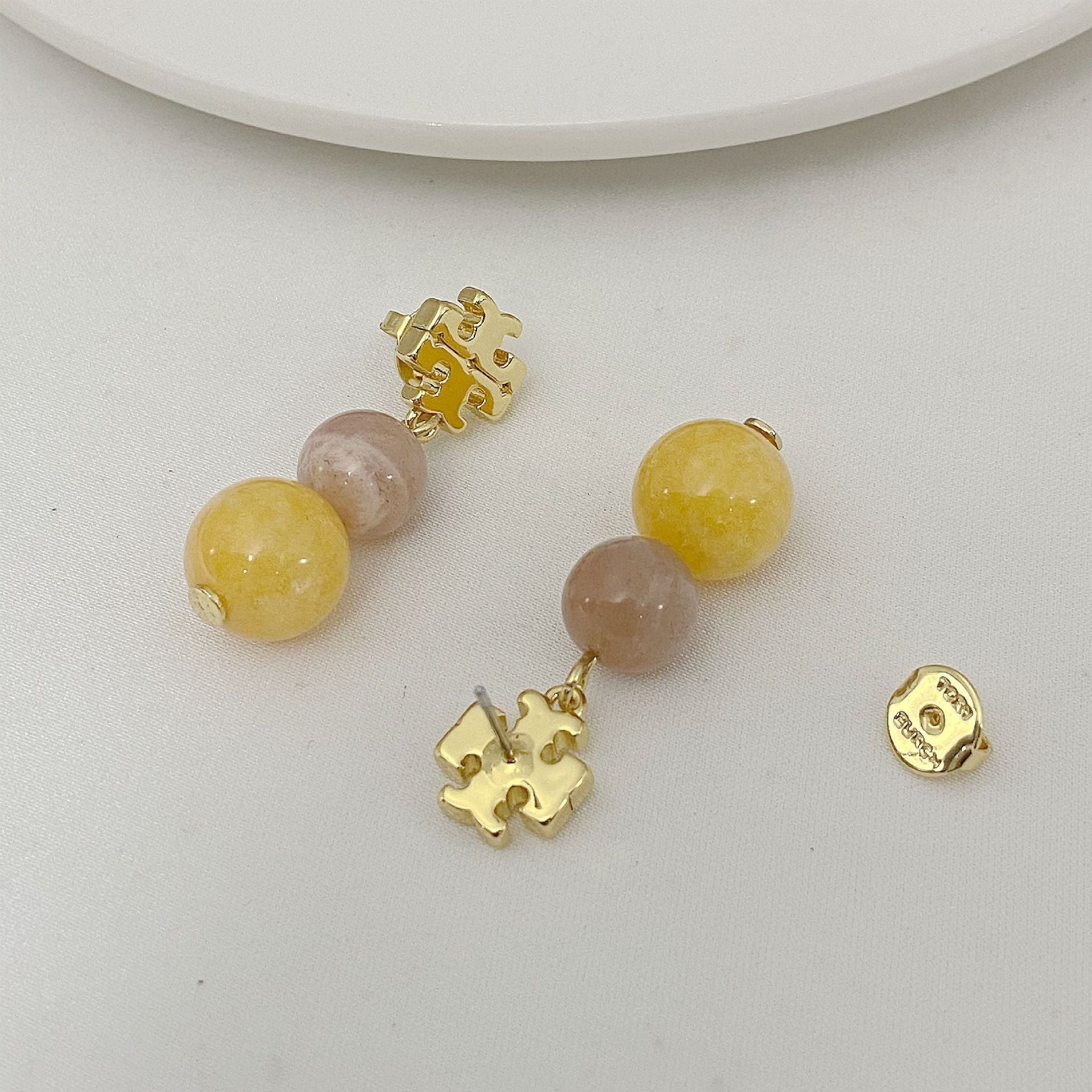 Tory Burch logo pendant earrings with yellow and pale pink agate beads