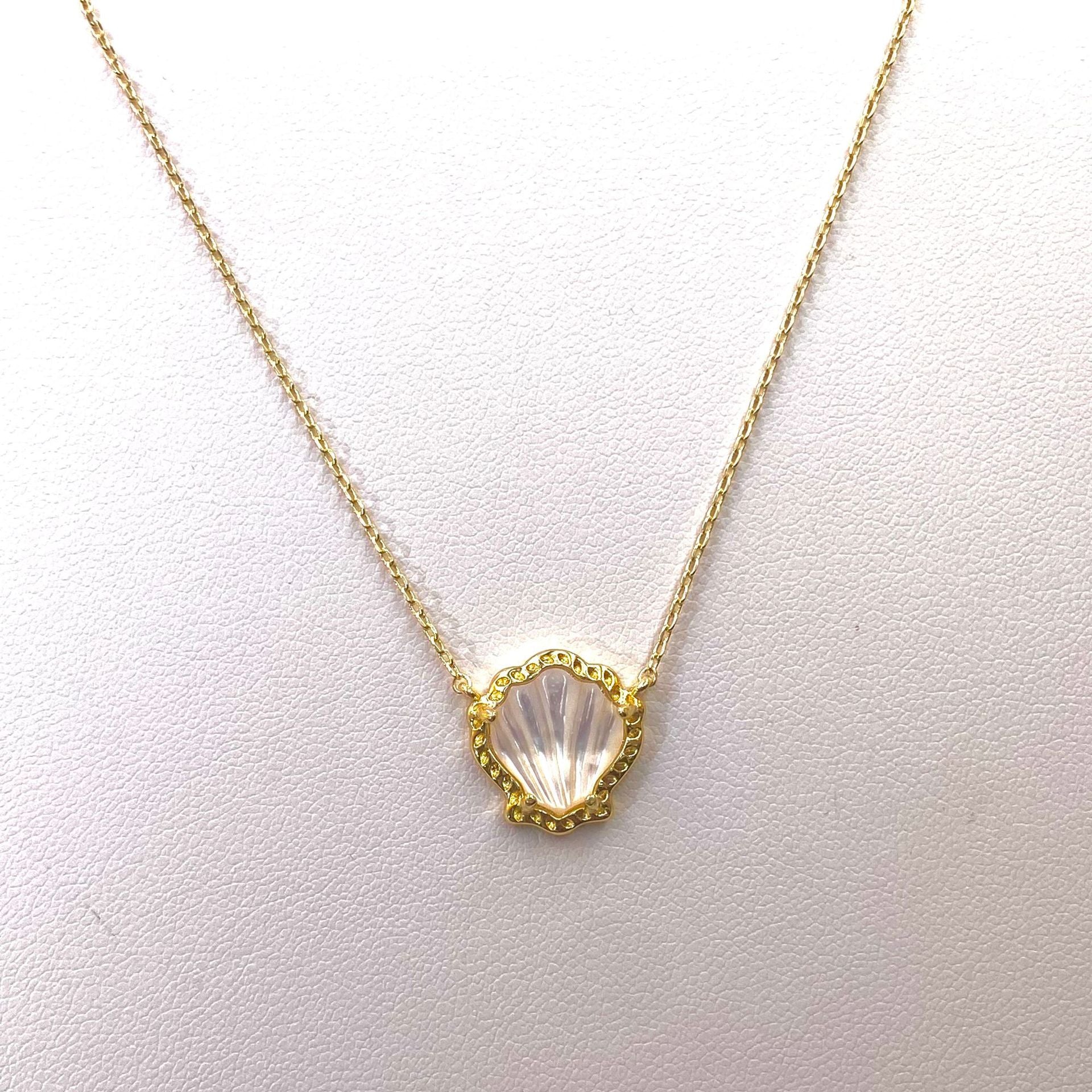 Gold-tone scallop pendant necklace with mother-of-pearl shell center