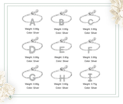 Set of pavé initial letter bracelets in sterling silver, shown with letters A–I