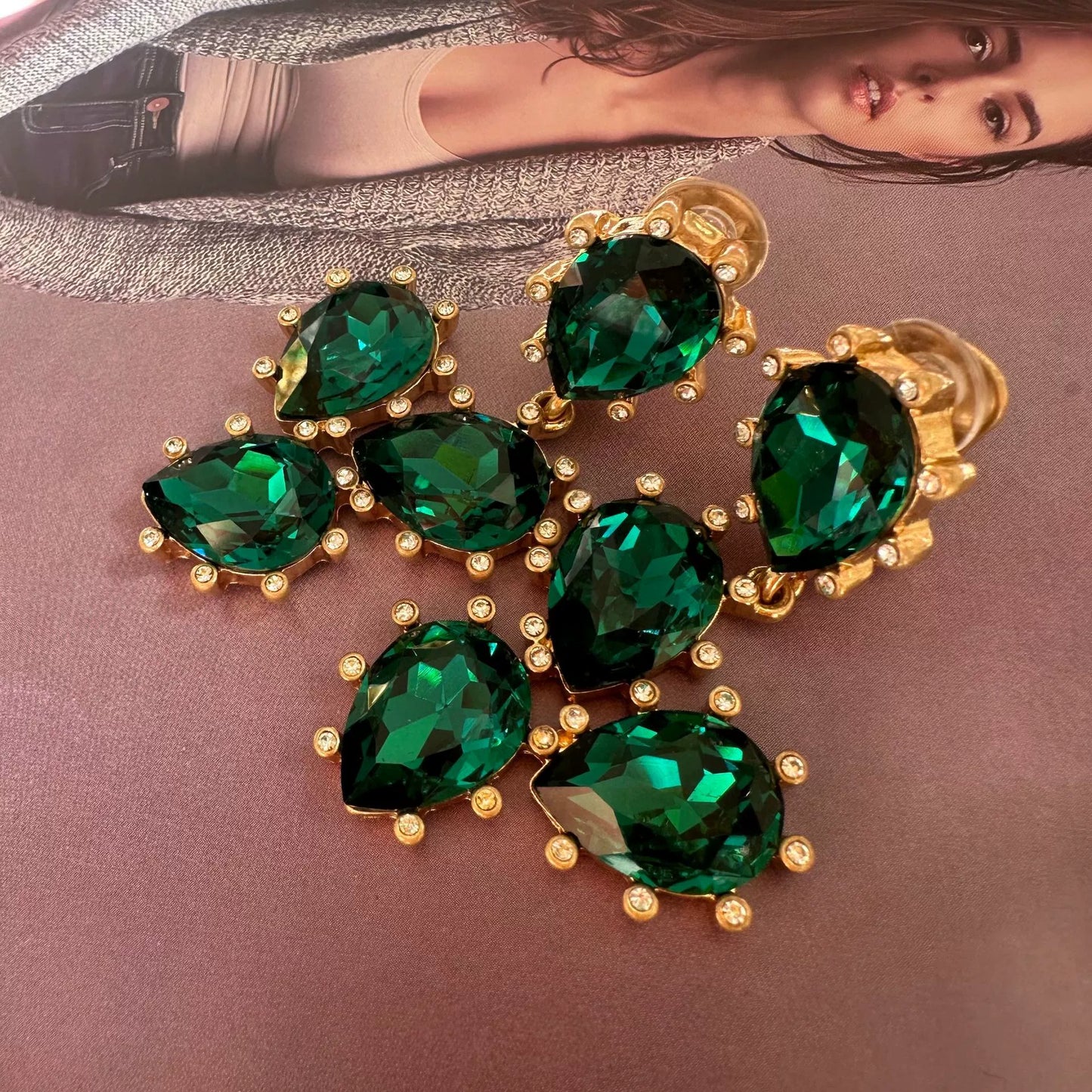 Cactus-cut glass ear clips with deep green stones and gold-tone prong setting