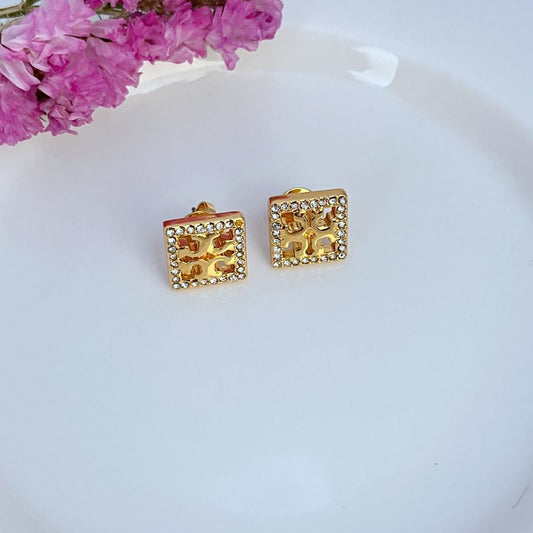 Gold-tone square rhinestone openwork stud earrings with ornate cutout center