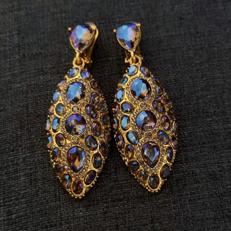 Purple and blue clip-on teardrop earrings with oval faceted crystals and gold tone