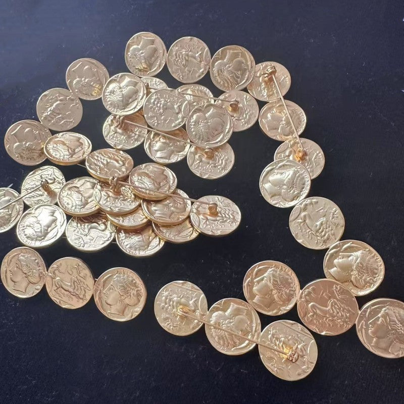 Antique-style gold-tone coin brooch with linked round Greek profile discs