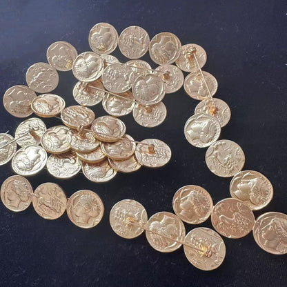 Antique-style gold-tone coin brooch with linked round Greek profile discs