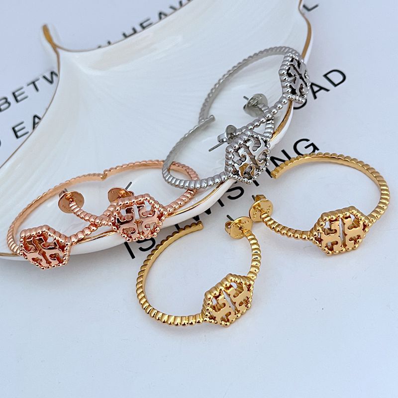 Tory Burch C-shaped hollow metal earrings for women