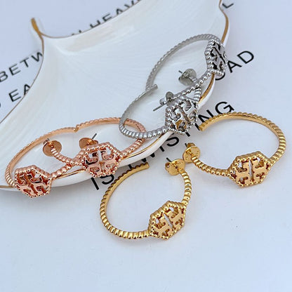 Tory Burch C-shaped hollow metal earrings for women