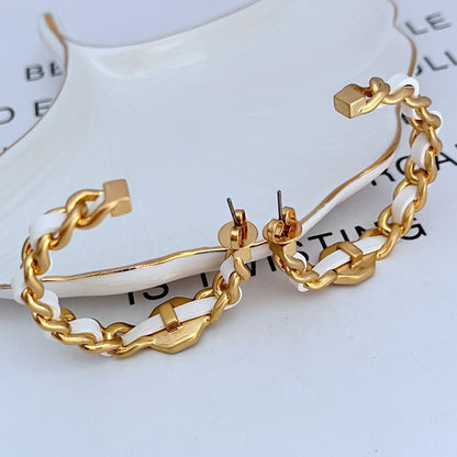 Leather-woven logo hoop earrings with linked gold-tone hardware and small logo plaques