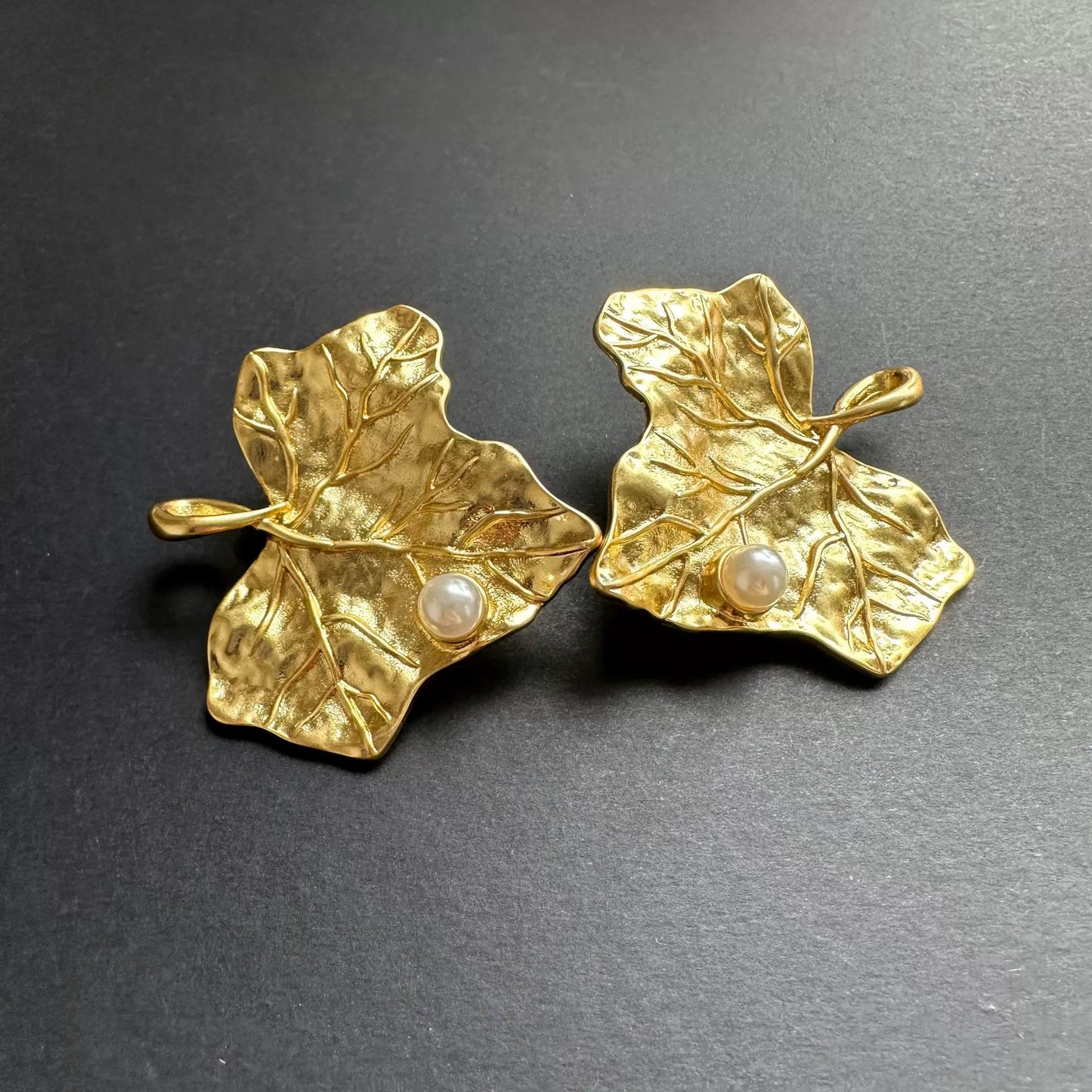 Gold-tone ivy leaf pearl earrings with leaf-shaped studs and white round pearls