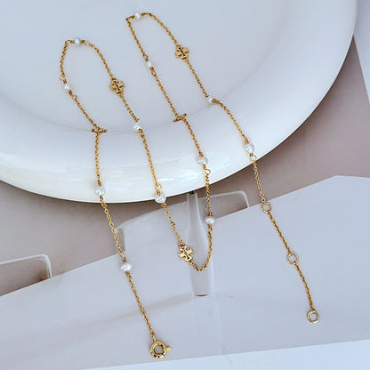 Gold-tone chain bracelets with freshwater pearls and logo charm links