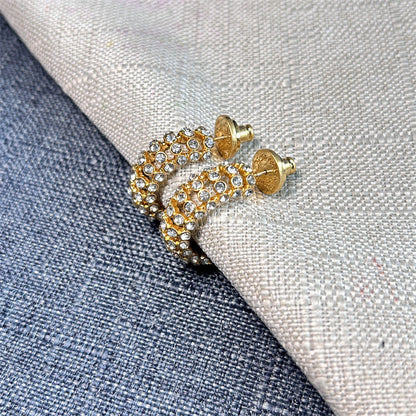 Gold-tone hoop earrings with clear cubic zirconia stones and stud backs