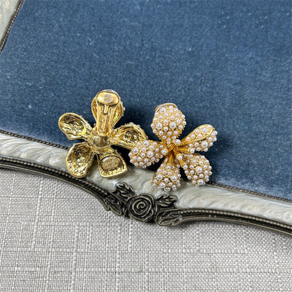 Five-petal flower stud earrings with white pearl-like beads and crystals on gold-tone setting