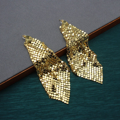 Gold sequin fan-shaped drop earrings pair with ribbed sparkle texture