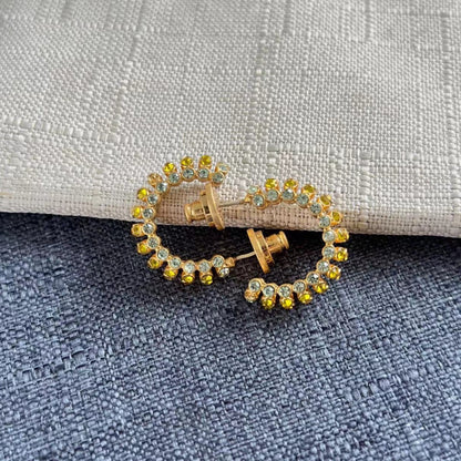 Gold-tone hoop earrings with yellow and blue cubic zirconia stones