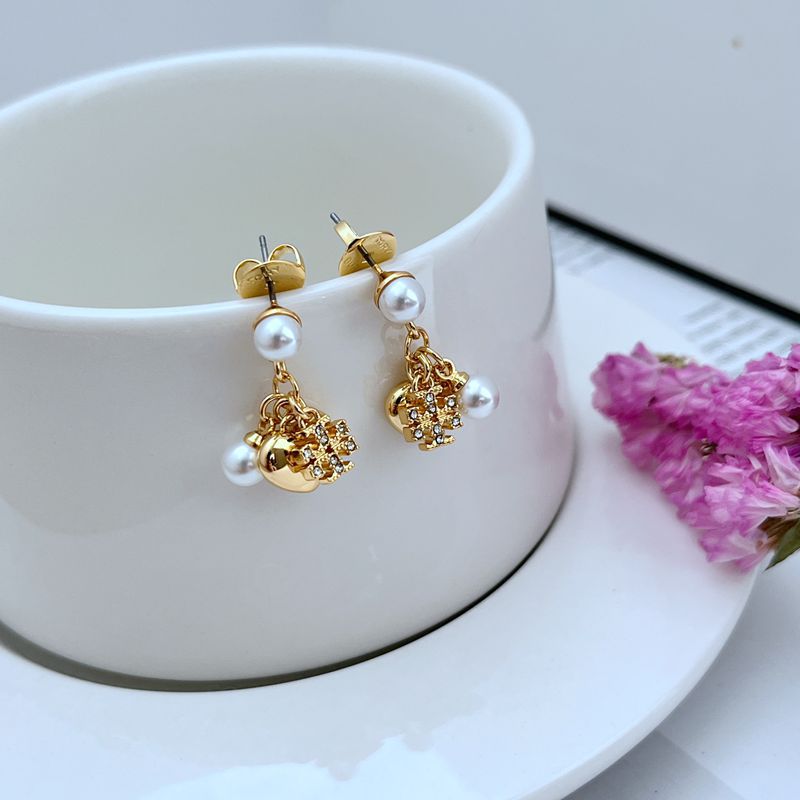 Gold-tone heart dangle earrings with rhinestone charm and dangling white pearl beads