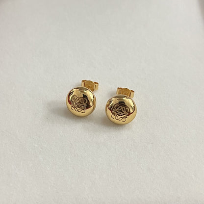 Gold round stud earrings with smooth bean shape and engraved knot design, stud backs