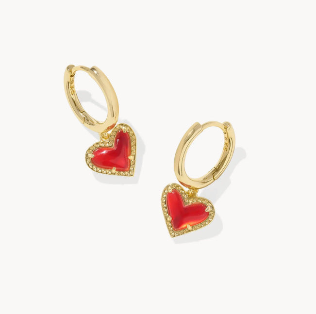 Gold heart pendant hoop earrings with red heart stone and textured gold bezel trim