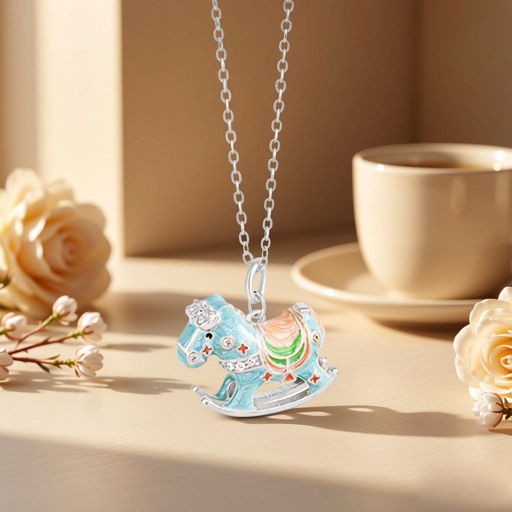 Enamel-painted rocking horse necklace with blue horse charm on silver chain