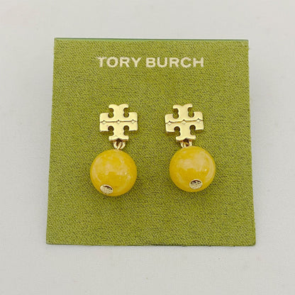 Tory Burch logo pendant earrings with yellow agate beads and gold logo studs