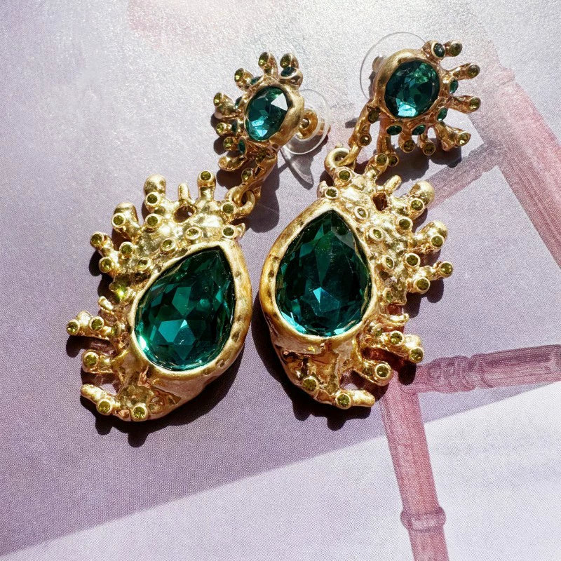 Gold-plated cactus crystal dangle earrings with dark green teardrop gemstones and spiky settings