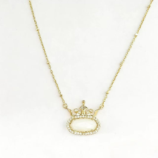 Gold-plated princess crown necklace with clear oval gemstone and halo, delicate chain