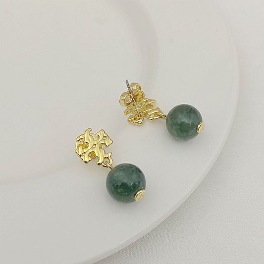 Gold-tone agate pendant earrings with round green stones and leaf-like drops