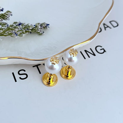 White round pearl geometric stud earrings with gold-tone posts and backs