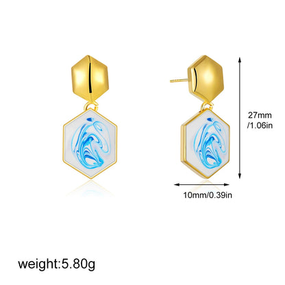 Gold-tone hexagon drop earrings with blue marble swirl inlay
