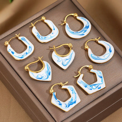 Set of gold-tone blue marble hoop earrings with scalloped and oval shapes