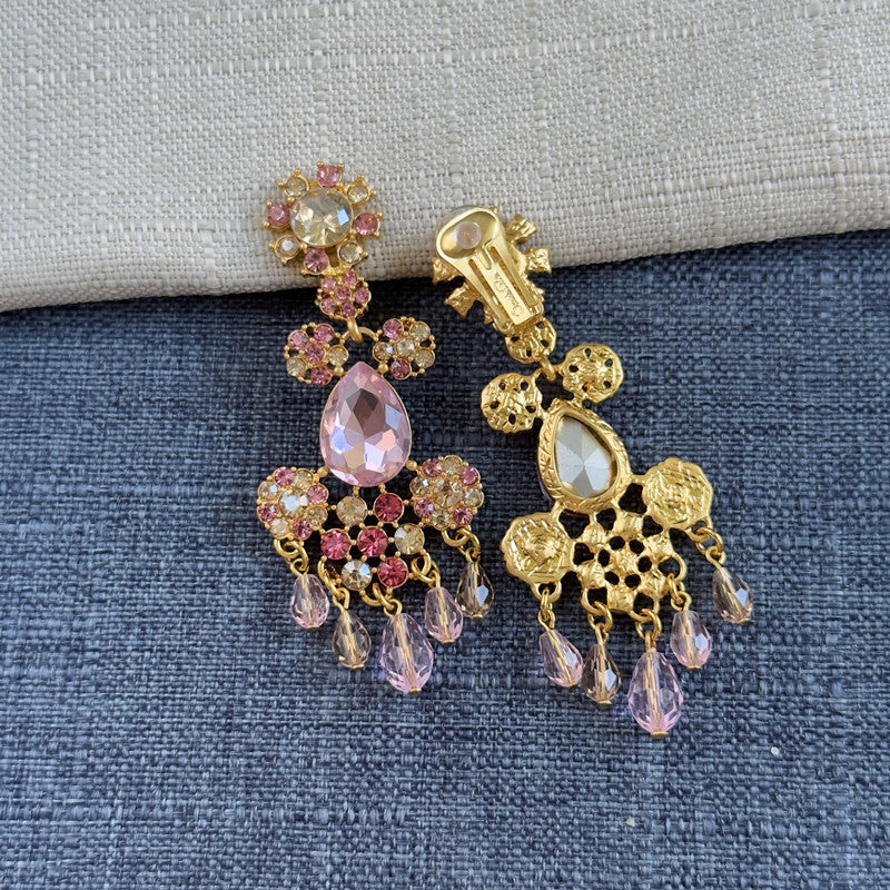 Pink rhinestone tassel clip-on earrings with gold-toned clasp and hanging drops