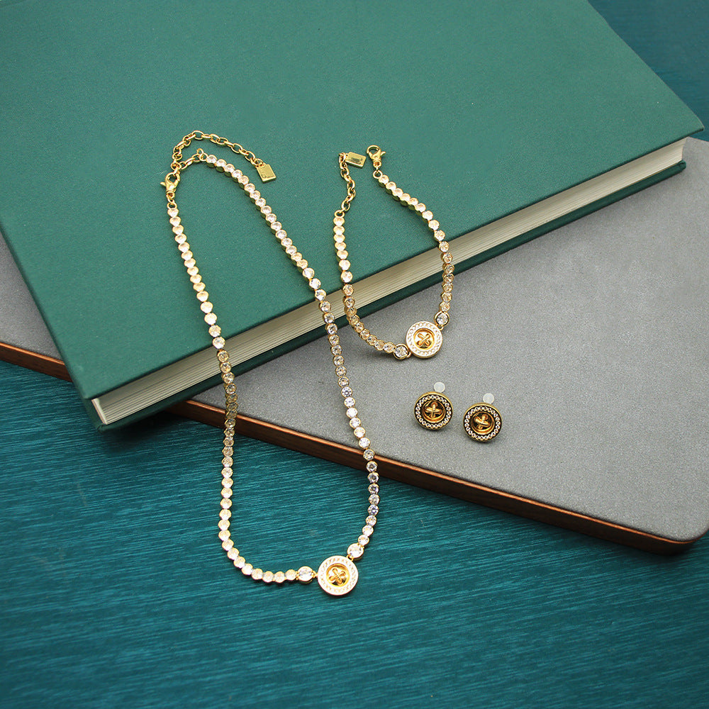 Gold-tone beaded charm necklace set with round coin clover pendant and stud earrings