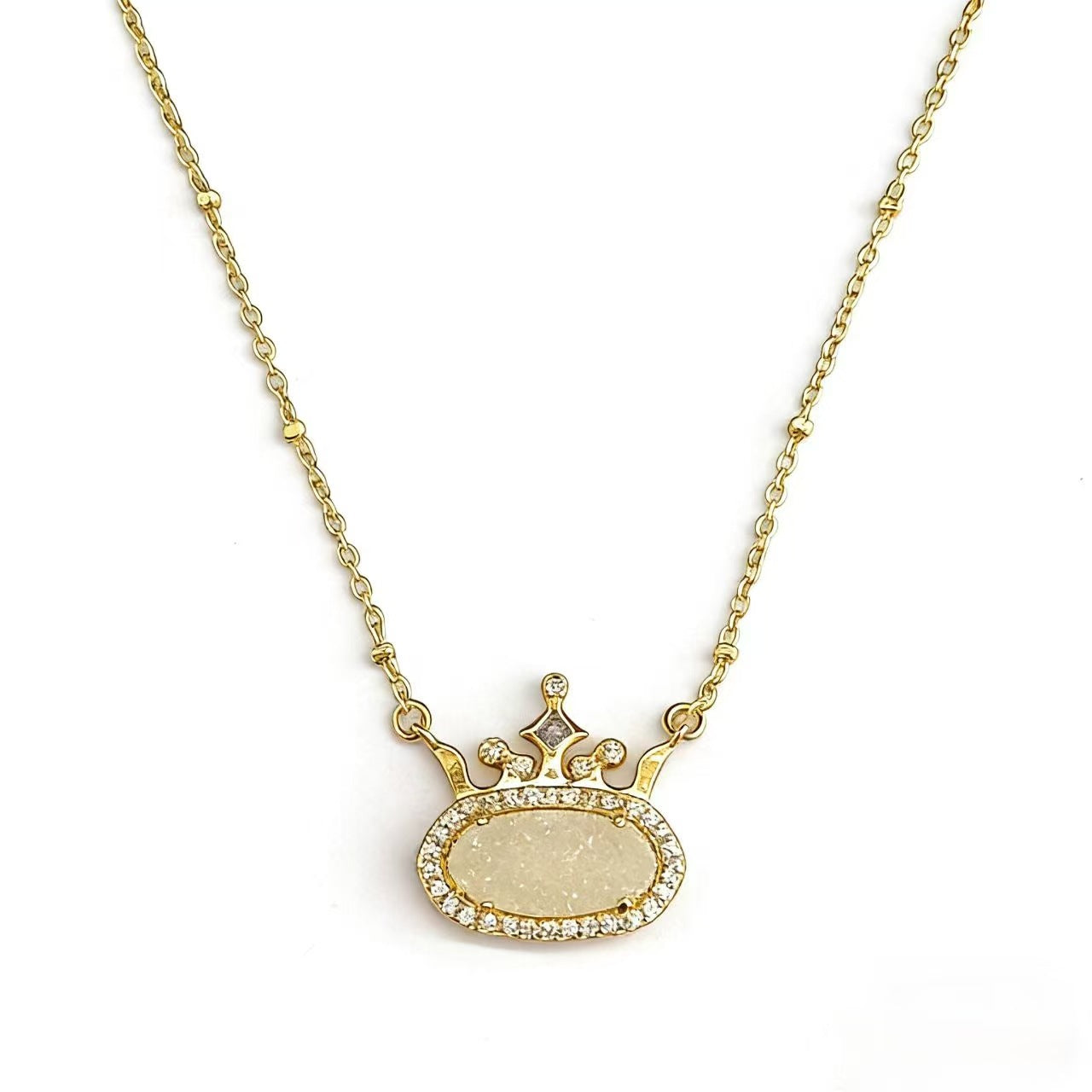 Gold-plated princess crown necklace with light beige oval gemstone and diamond-style halo