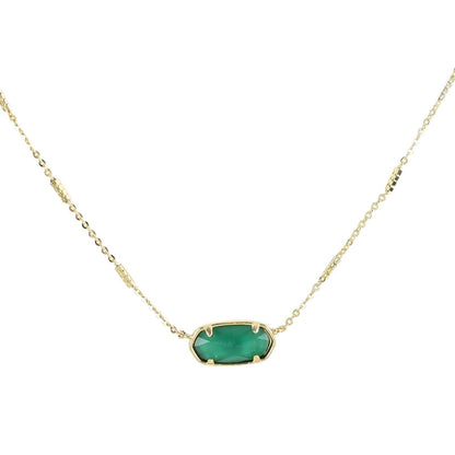 Oval crystal pendant necklace with teal green stone and gold bezel on a gold chain