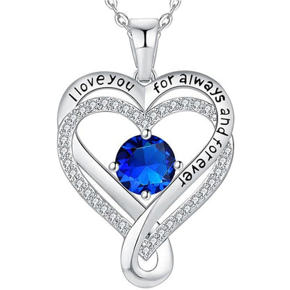 Silver heart pendant necklace with dark blue round gemstone and pave double-heart frame
