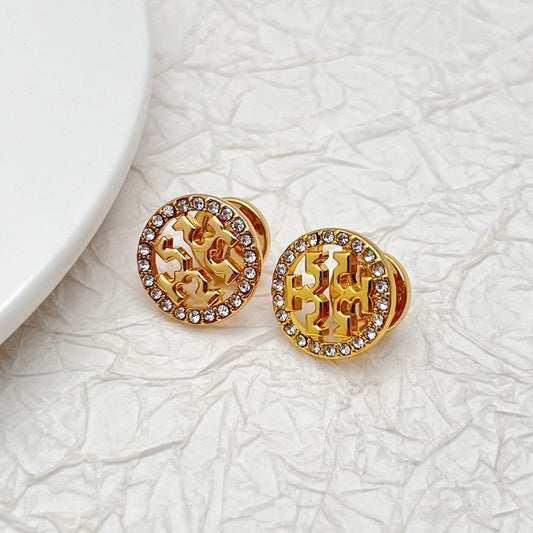 Tory Burch logo stud earrings, gold-tone round discs with openwork pattern and rhinestone rim