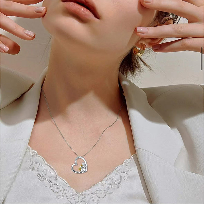 Sterling silver heart pendant necklace on a chain, mother-and-child design