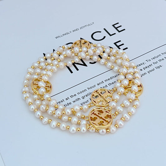 Tory Burch round hollow letter pearl sweater necklace