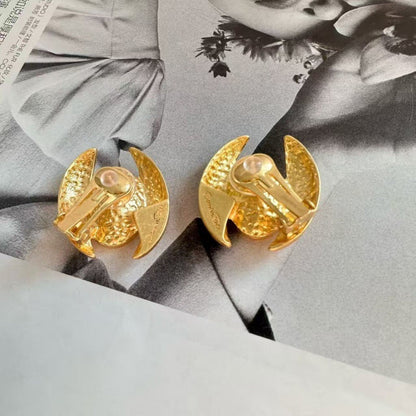 Gold-tone oval stud earrings with textured backs and hinge posts