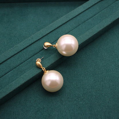 Gold faux-pearl drop earrings with blush-pink spheres and small hoop links
