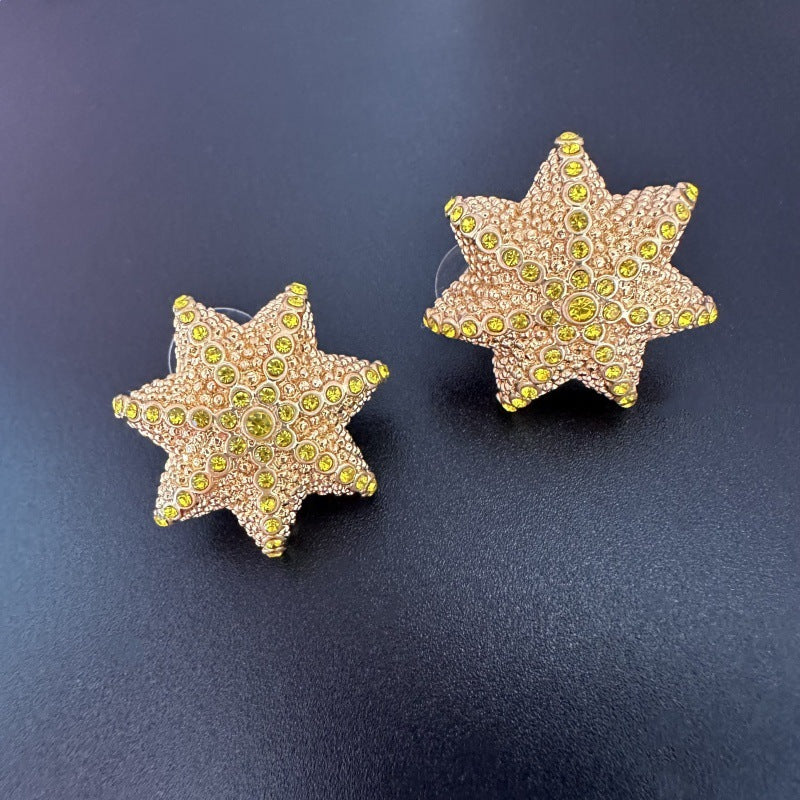 Star cactus earrings, gold tone star shape with green center rhinestones