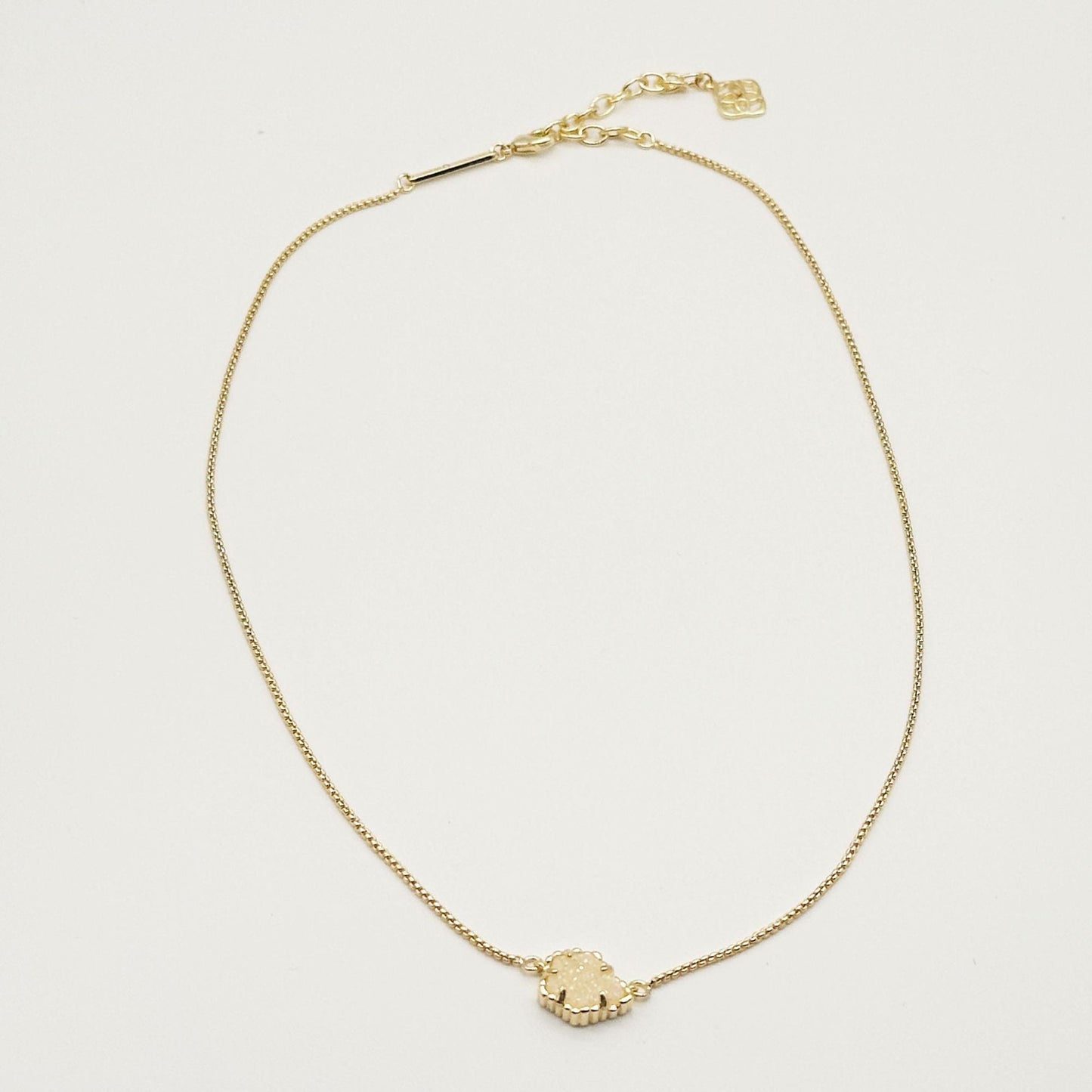 Kendra Scott gold-tone mother-of-pearl necklace with scalloped irregular rhombus pendant