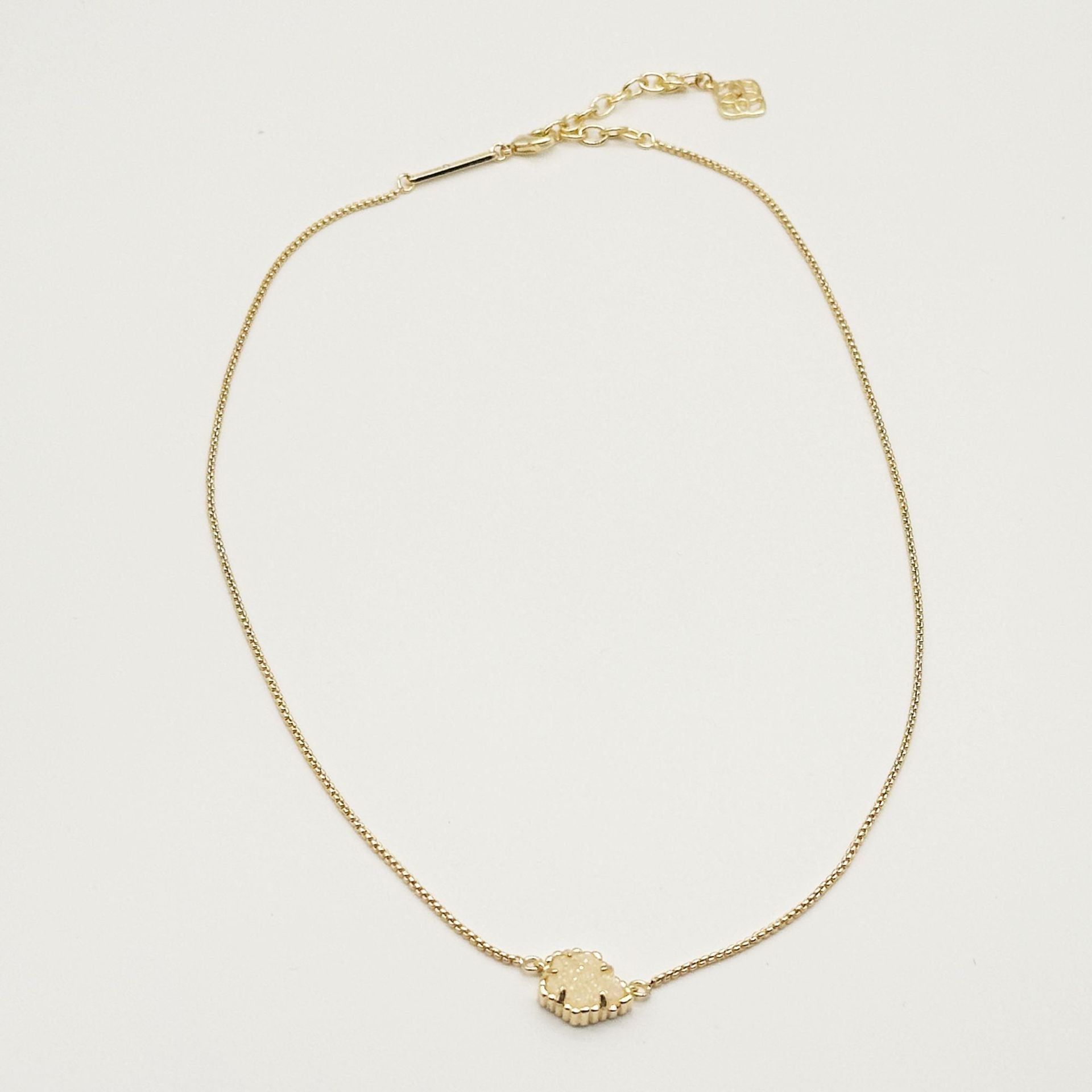 Kendra Scott gold-tone mother-of-pearl necklace with scalloped irregular rhombus pendant