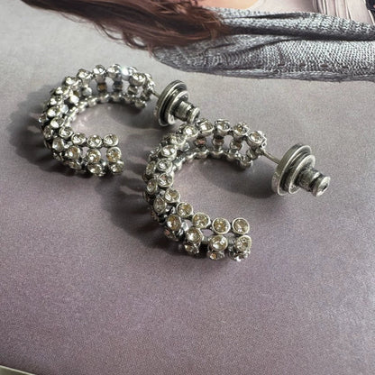 Silver-tone hoop earrings with clear cubic zirconia stones and push backs