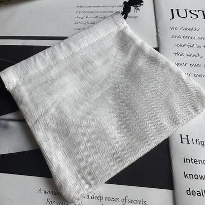 White packaging pouch with chevron texture and black tassel